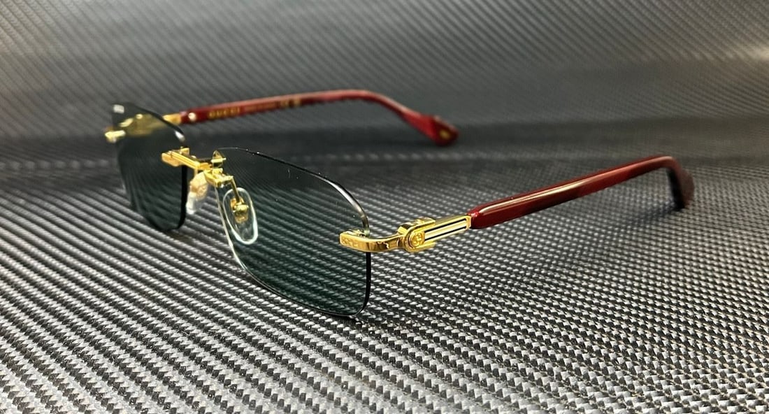 GUCCI GG1221S 003 Gold Burgundy Metal Sunglasses with Green Lenses: GUCCI GG1221S 003 Gold Burgundy Metal Sunglasses with Green Lenses Elevate your accessory collection with these stylish GUCCI GG1221S 003 sunglasses. Featuring a luxurious gold and burgundy metal fram