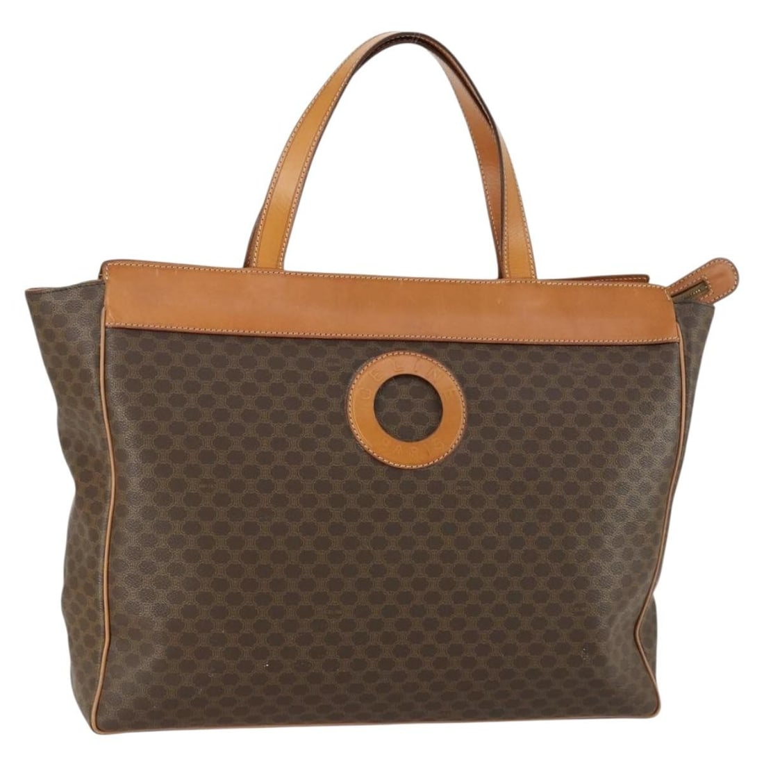 Vintage Macadam Canvas and Leather Handbag by Celine Brown Italy: Vintage Macadam Canvas and Leather Handbag by Celine Brown Italy This Celine Vintage Macadam handbag features a classic brown canvas exterior with leather accents. Designed for women, it offers a spac