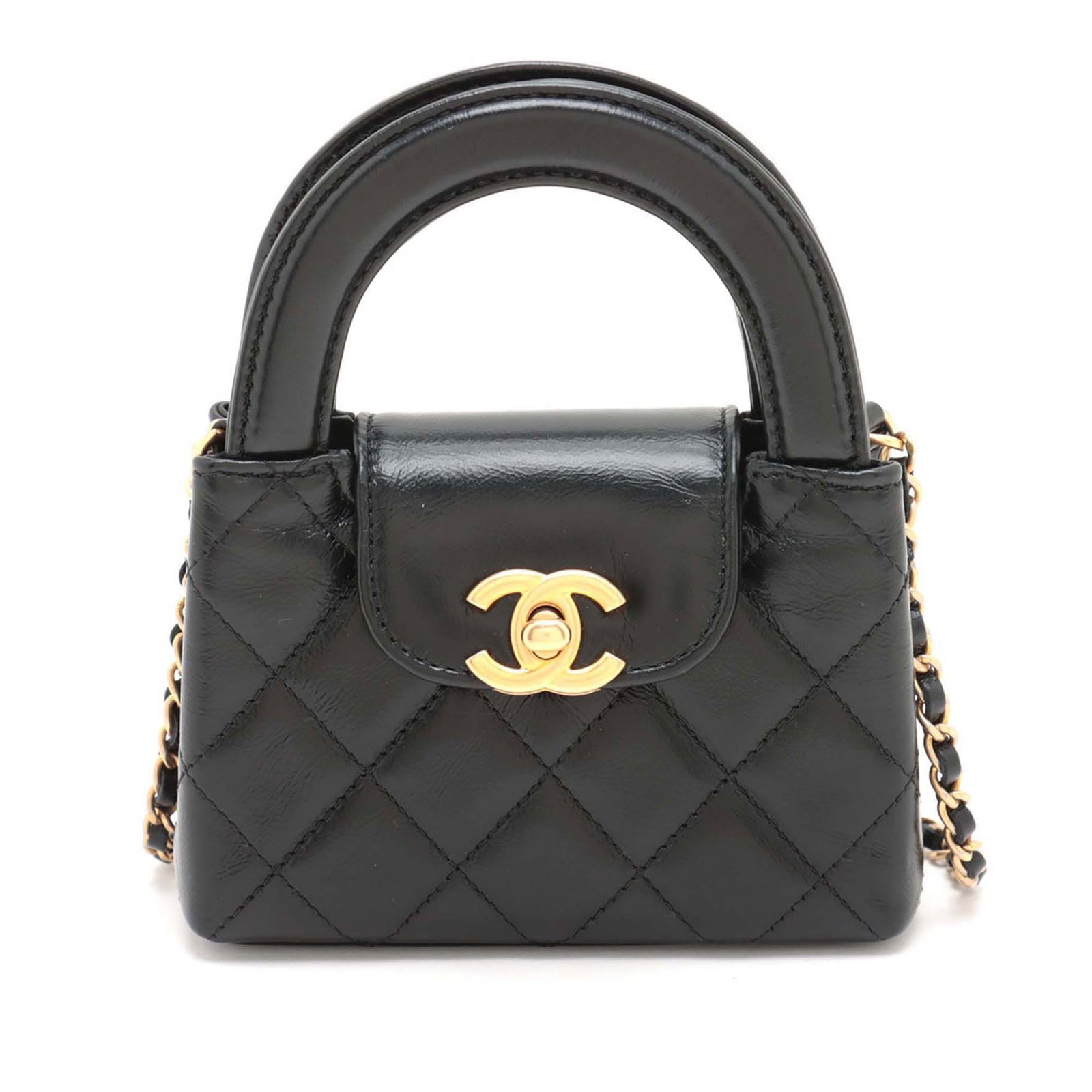 Black Aged Calfskin Mini Nano Shopper Satchel by Chanel with Chain Strap: Black Aged Calfskin Mini Nano Shopper Satchel by Chanel with Chain Strap This Chanel Mini Nano Kelly Shopper Bag is crafted from aged calfskin leather in black and features flat leather handles, a lea