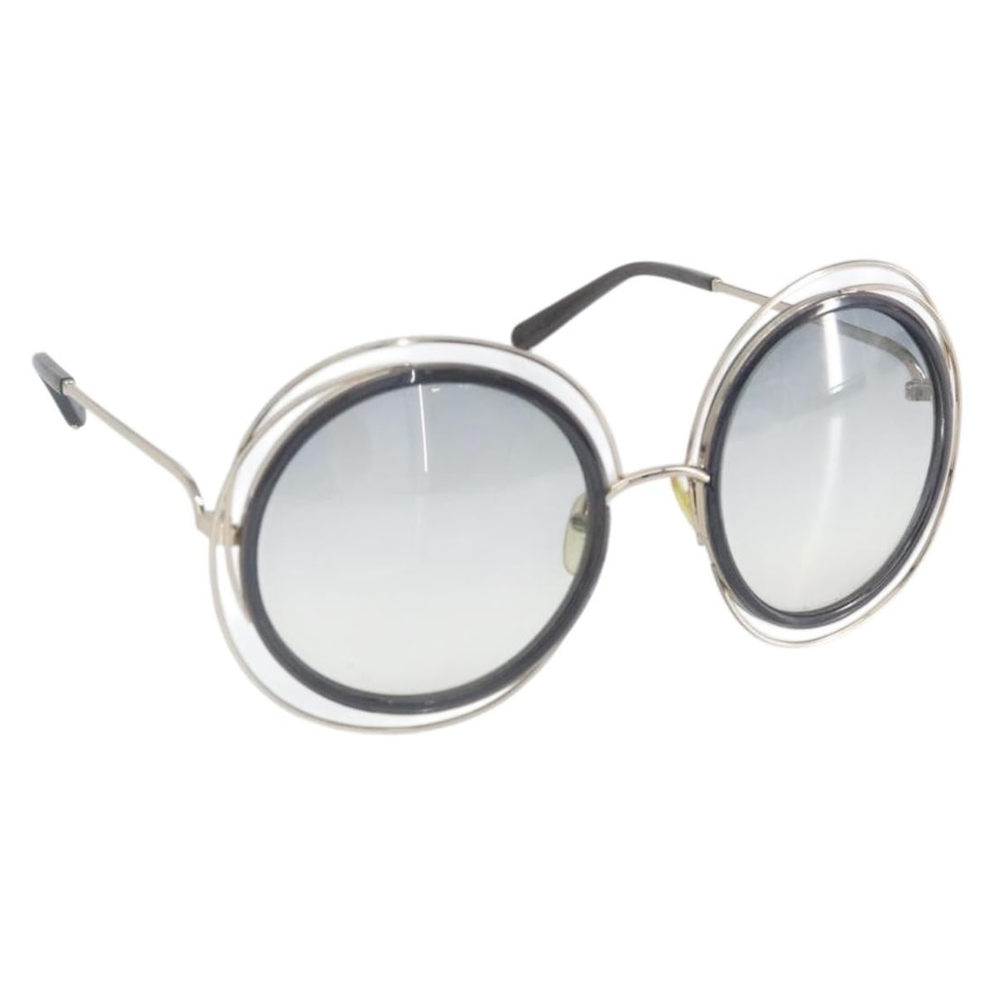 Black Metal Sunglasses by Chloe with Case: Black Metal Sunglasses by Chloe with Case These Chloe sunglasses feature a sleek black metal frame, offering a stylish and modern accessory. Made in Italy, they include a matching sunglass case. The s