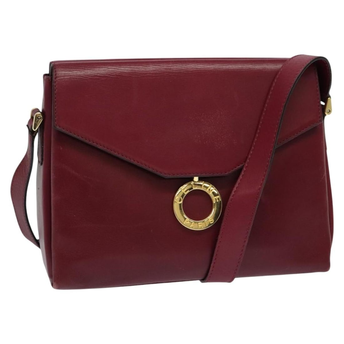 Burgundy leather shoulder bag Celine Circle logo design: Burgundy leather shoulder bag Celine Circle logo design This pre-owned Celine Circle Logo shoulder bag features a burgundy leather exterior with a classic design. Designed for women, it shows signs of
