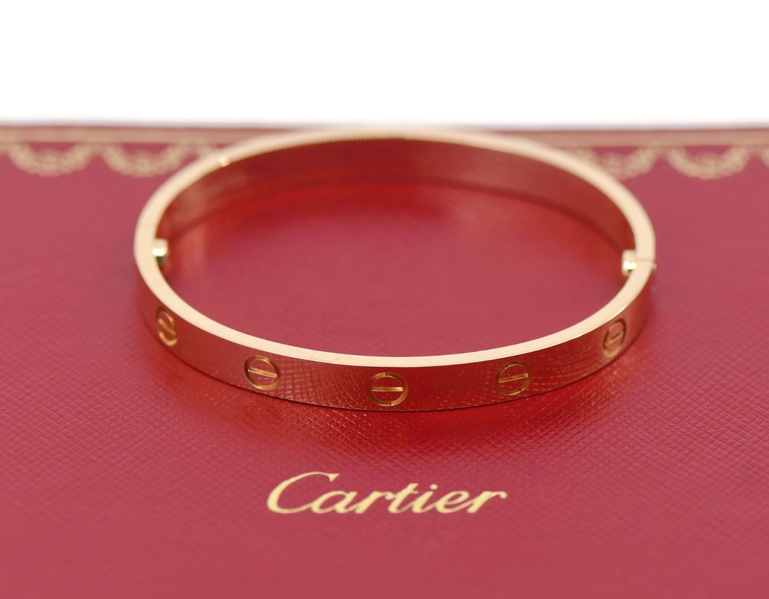 Cartier 18K Rose Gold Love Bangle Bracelet Size 16 Authentic: Cartier 18K Rose Gold Love Bangle Bracelet Size 16 Authentic This exquisite Cartier Love Bracelet is crafted from 18K rose gold, featuring a stunning pink hue that embodies elegance and sophistication