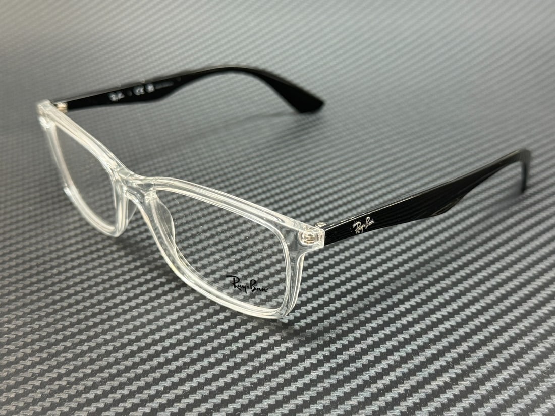 Ray Ban RX7047 5943 Transparent Square 56mm Unisex Eyeglasses with Case: Ray Ban RX7047 5943 Transparent Square 56mm Unisex Eyeglasses with Case Introducing the Ray Ban RX7047 5943 Unisex Eyeglasses, a stylish accessory that combines modern design with functionality. These