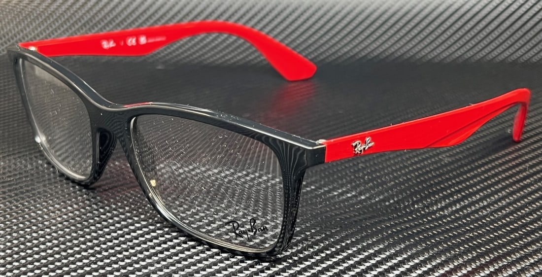 Ray Ban RX7047 2475 Black Square Unisex Eyeglasses with Clear Lenses: Ray Ban RX7047 2475 Black Square Unisex Eyeglasses with Clear Lenses Elevate your eyewear collection with these RAY BAN RX7047 2475 unisex eyeglasses. Featuring a classic square design, these eyeglass