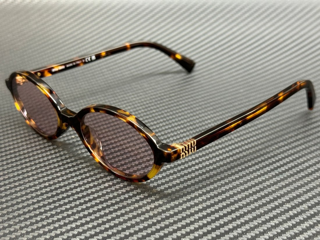 Miu Miu MU 04ZSF 14L4I0 Honey Havana Pink Sunglasses with Authenticity: Miu Miu MU 04ZSF 14L4I0 Honey Havana Pink Sunglasses with Authenticity Elevate your style with these Miu Miu MU 04ZSF 14L4I0 sunglasses, featuring a chic Honey Havana frame paired with striking pink l