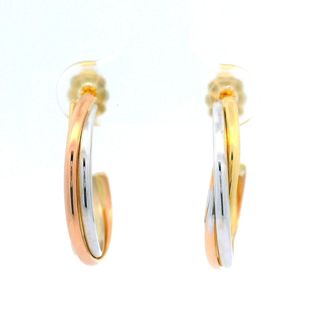 Estate 18k Tri-Color Gold Medium Twist Hoop Earrings: Estate 18k Tri-Color Gold Medium Twist Hoop Earrings These stunning medium twist hoop earrings showcase a classic tri-color design crafted from solid 18k gold. The earrings feature a harmonious blend