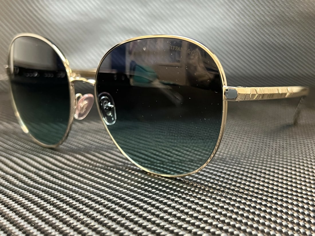 Tiffany & Co. TF3079 60019S Silver Round Sunglasses with Azure Gradient Lenses: Tiffany & Co. TF3079 60019S Silver Round Sunglasses with Azure Gradient Lenses Elevate your style with these stunning Tiffany & Co. TF3079 60019S sunglasses. Featuring a sophisticated round frame in a