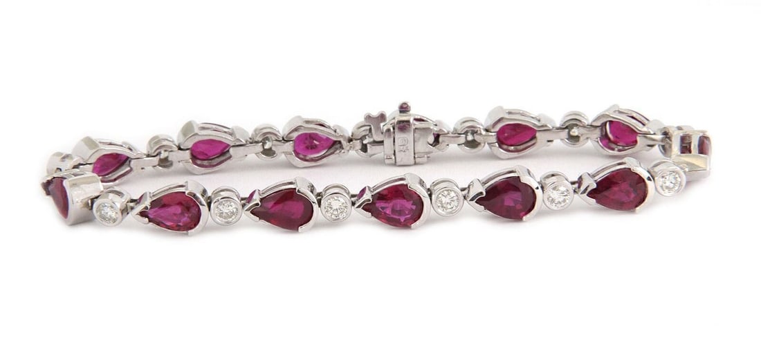 Vintage Tennis Bracelet with Diamonds and Rubies in 14k White Gold Pear Links: Vintage Tennis Bracelet with Diamonds and Rubies in 14k White Gold Pear Links This vintage tennis bracelet showcases a sophisticated design with sparkling diamonds and vibrant pear-shaped rubies, all