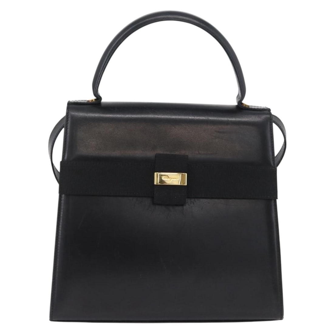Black Leather Vara Shoulder Bag by Salvatore Ferragamo Italy: Black Leather Vara Shoulder Bag by Salvatore Ferragamo Italy This Salvatore Ferragamo Vara handbag is crafted from black leather and designed for women. Made in Italy, it features a structured silhoue