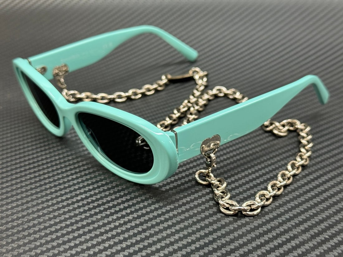 Tiffany & Co. TF4221 8388S4 Women's 54mm Blue Grey Sunglasses with Authenticity: Tiffany & Co. TF4221 8388S4 Women's 54mm Blue Grey Sunglasses with Authenticity Elevate your accessory game with these stunning Tiffany & Co. sunglasses. Featuring a captivating Tiffany Blue frame, th