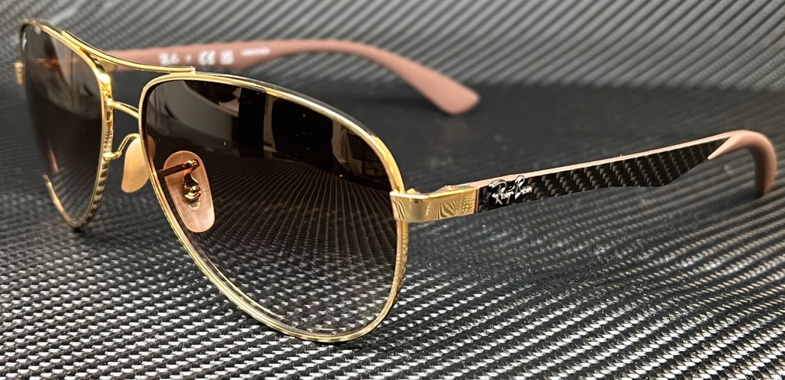 Ray-Ban RB8313 001 51 Gold Arista Men's Sunglasses 61mm: Ray-Ban RB8313 001 51 Gold Arista Men's Sunglasses 61mm Elevate your eyewear game with these stylish Ray-Ban RB8313 sunglasses. Featuring a stunning Gold Arista frame, these sunglasses are designed fo
