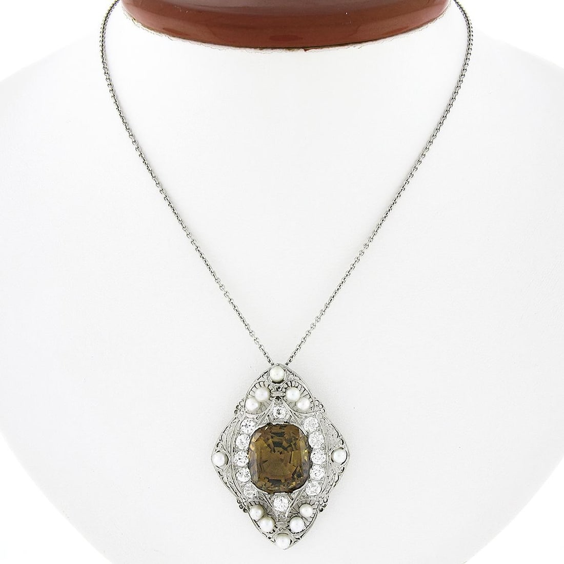 Antique Edwardian GIA Certified Chrysoberyl Diamond Pearl Platinum Pendant: Antique Edwardian GIA Certified Chrysoberyl Diamond Pearl Platinum Pendant Discover an exquisite Antique Edwardian pendant featuring a striking large GIA-certified chrysoberyl at its center. This stun