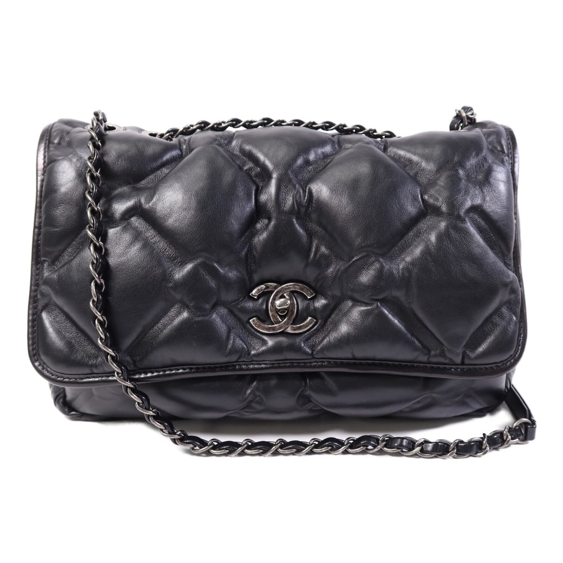 CHANEL Black Lambskin Leather Shoulder Bag with Silver Hardware: CHANEL Black Lambskin Leather Shoulder Bag with Silver Hardware Elevate your style with this exquisite CHANEL CC Shoulder Bag, crafted from luxurious lambskin leather in a classic black hue. This shou