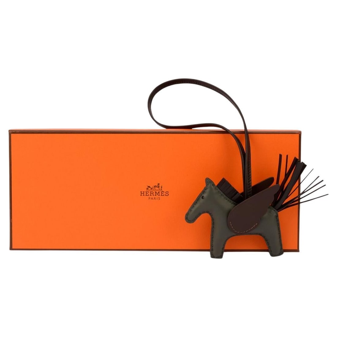 Hermes Pegase Rodeo PM Leather Bag Charm with Wings in Box: Hermes Pegase Rodeo PM Leather Bag Charm with Wings in Box The Hermes Rodeo Pegase PM charm is crafted in France and features an added wing detail inspired by the mythical Pegasus. Designed as a leath