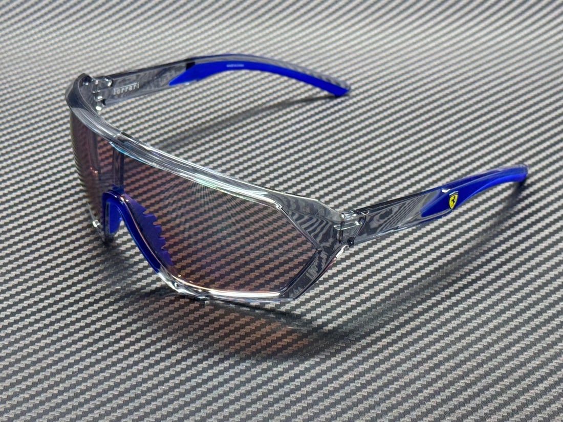 FERRARI FZ6017U 524 7V Opal Grey Blue Mirror Sunglasses 66mm: FERRARI FZ6017U 524 7V Opal Grey Blue Mirror Sunglasses 66mm Elevate your eyewear collection with these stylish Ferrari FZ6017U 524 7V sunglasses. Featuring a sleek opal grey frame complemented by str