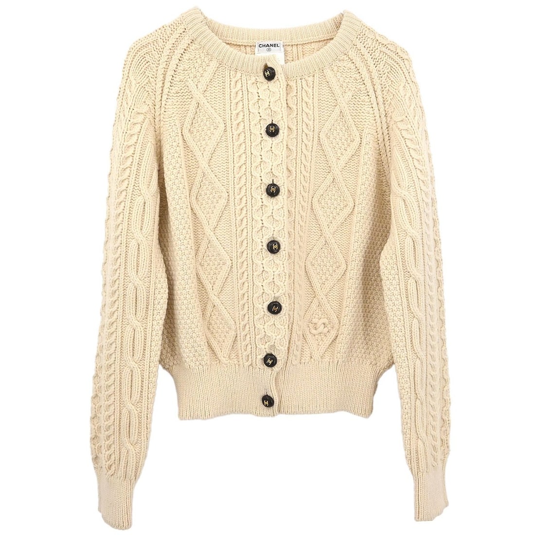 White Wool Cardigan Sweater Chanel Fisherman Style 96A Size 44: White Wool Cardigan Sweater Chanel Fisherman Style 96A Size 44 This Chanel Fisherman Cardigan is crafted from 100% wool in a classic white color. Designed with a round neckline and a regular fit, this