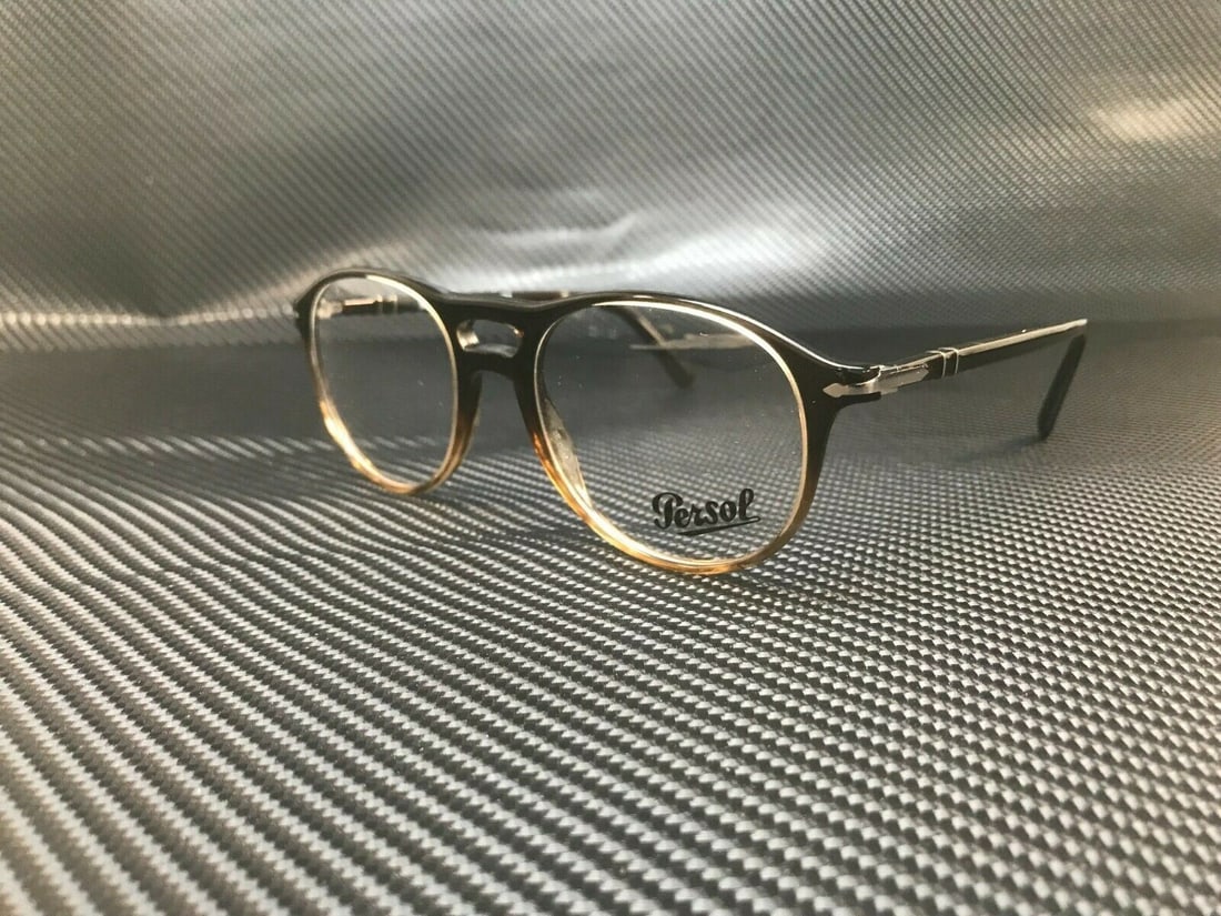 Persol PO3202V 1026 Gradient Black Eyeglasses with Demo Lenses: Persol PO3202V 1026 Gradient Black Eyeglasses with Demo Lenses Introducing the Persol PO3202V 1026 eyeglasses, a stylish accessory designed for men. These glasses feature a sleek gradient black frame