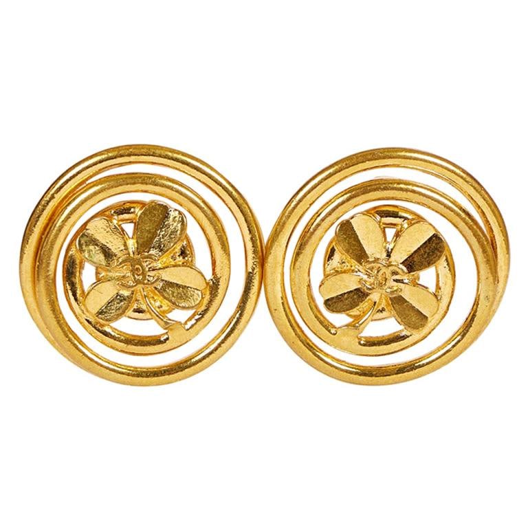 Chanel 1994 Vintage Oversize Clover Logo Earrings with Pouch: Chanel 1994 Vintage Oversize Clover Logo Earrings with Pouch Step back in time with these exquisite 1990's Vintage Chanel Oversize Clover Logo Earrings. Crafted in France in 1994, these earrings featu
