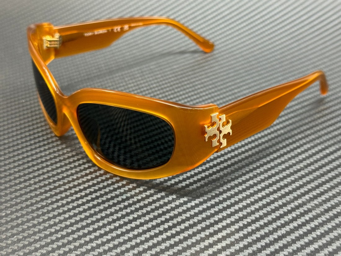 Tory Burch TY7211 195887 Dark Orange Women's Sunglasses with Grey Lenses: Tory Burch TY7211 195887 Dark Orange Women's Sunglasses with Grey Lenses Experience stylish sun protection with these Tory Burch TY7211 sunglasses. Featuring a striking dark orange frame complemented