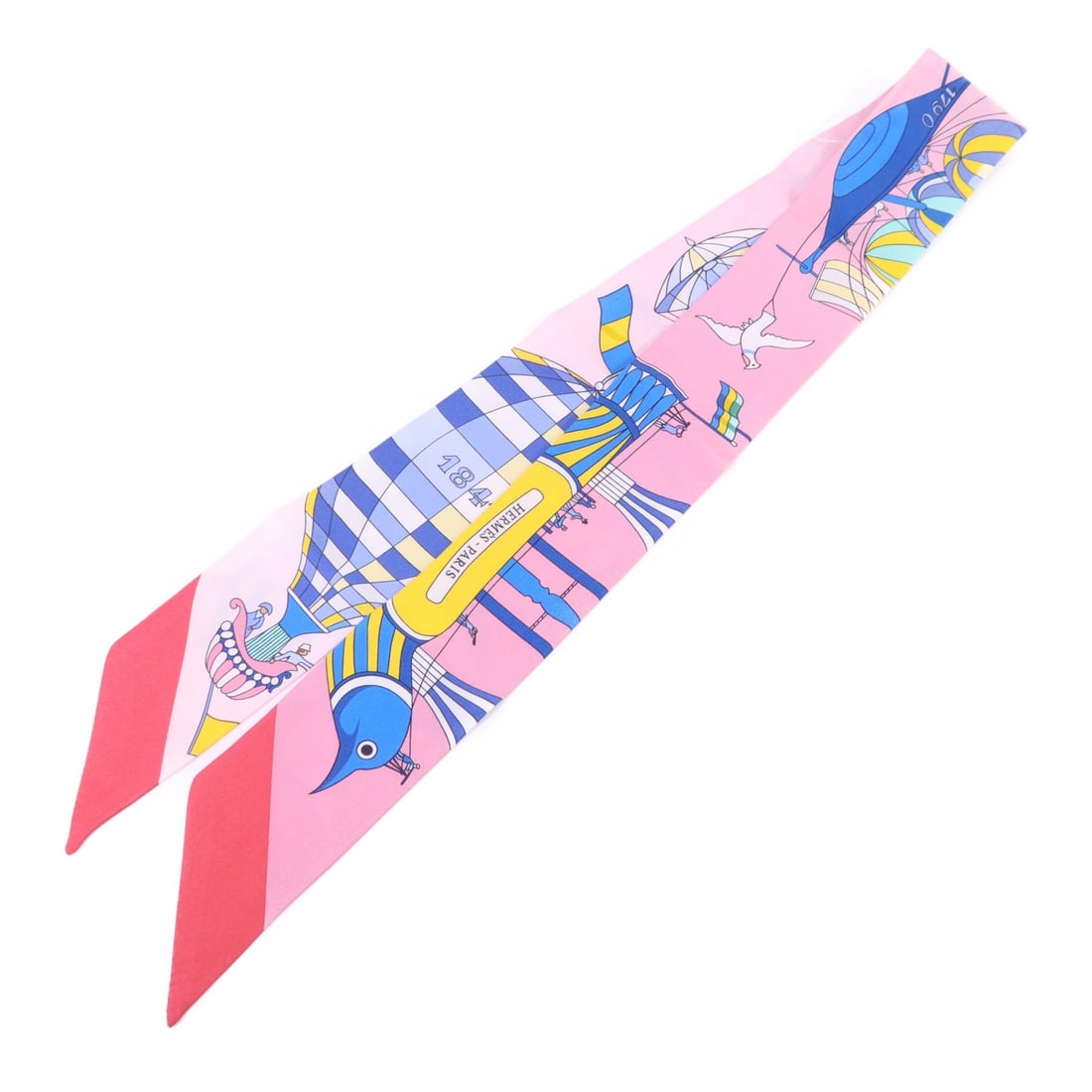 Silk Twilly Scarf by Hermes in Multicolor: Silk Twilly Scarf by Hermes in Multicolor This Hermes Twilly scarf is crafted from luxurious silk and features a vibrant multicolor design. Made in France, it is a stylish accessory suitable for vario