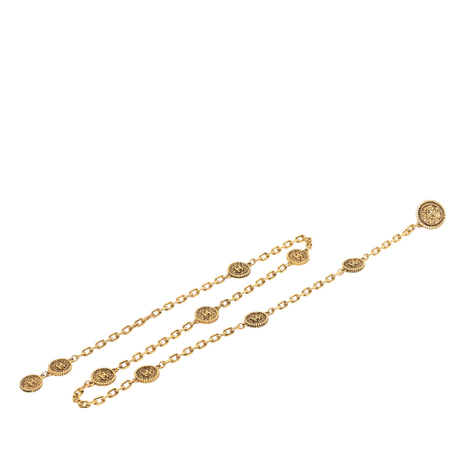 Chanel CC Medallion Belt in Gold Tone Metal with Chain Design: Chanel CC Medallion Belt in Gold Tone Metal with Chain Design This Chanel belt features a gold tone metal body with the iconic CC medallion and a hook closure. The belt is crafted in France and displa