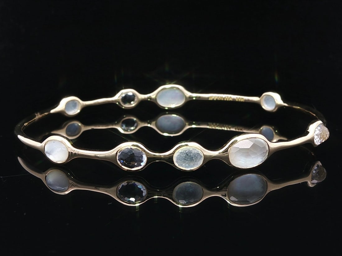 Ippolita 18k Gold Mother Of Pearl Gemstone Slip On Bangle: Ippolita 18k Gold Mother Of Pearl Gemstone Slip On Bangle This exquisite Ippolita bangle showcases a stunning arrangement of genuine mother of pearl and white gemstones, elegantly set in solid 18k yel