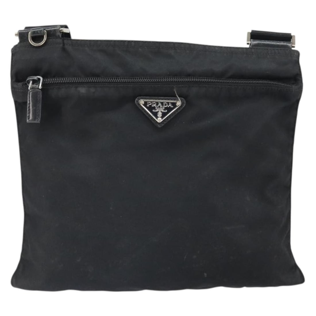 Prada Black Nylon Flat Messenger Bag for Women 29cm by 25cm: Prada Black Nylon Flat Messenger Bag for Women 29cm by 25cm This Prada Flat Messenger Bag for women features a black nylon exterior with leather accents. It shows signs of wear, including surface defo
