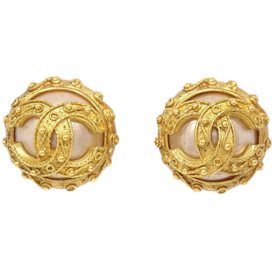 Chanel 94A Gold Tone Clip-On Earrings with Artificial Pearl Accent: Chanel 94A Gold Tone Clip-On Earrings with Artificial Pearl Accent These Chanel button-shaped earrings feature elegant artificial pearls set in gold-tone metal with a classic clip-on closure. Originat