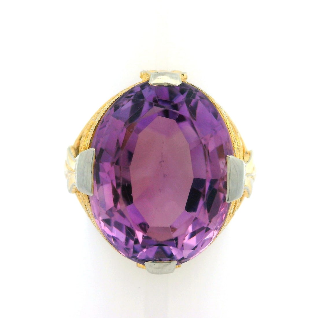 Antique Art Deco 18K Gold Amethyst Cocktail Ring Open Work Milgrain: Antique Art Deco 18K Gold Amethyst Cocktail Ring Open Work Milgrain Discover a stunning Antique Art Deco ring that beautifully combines elegance and craftsmanship. This exquisite piece features a larg