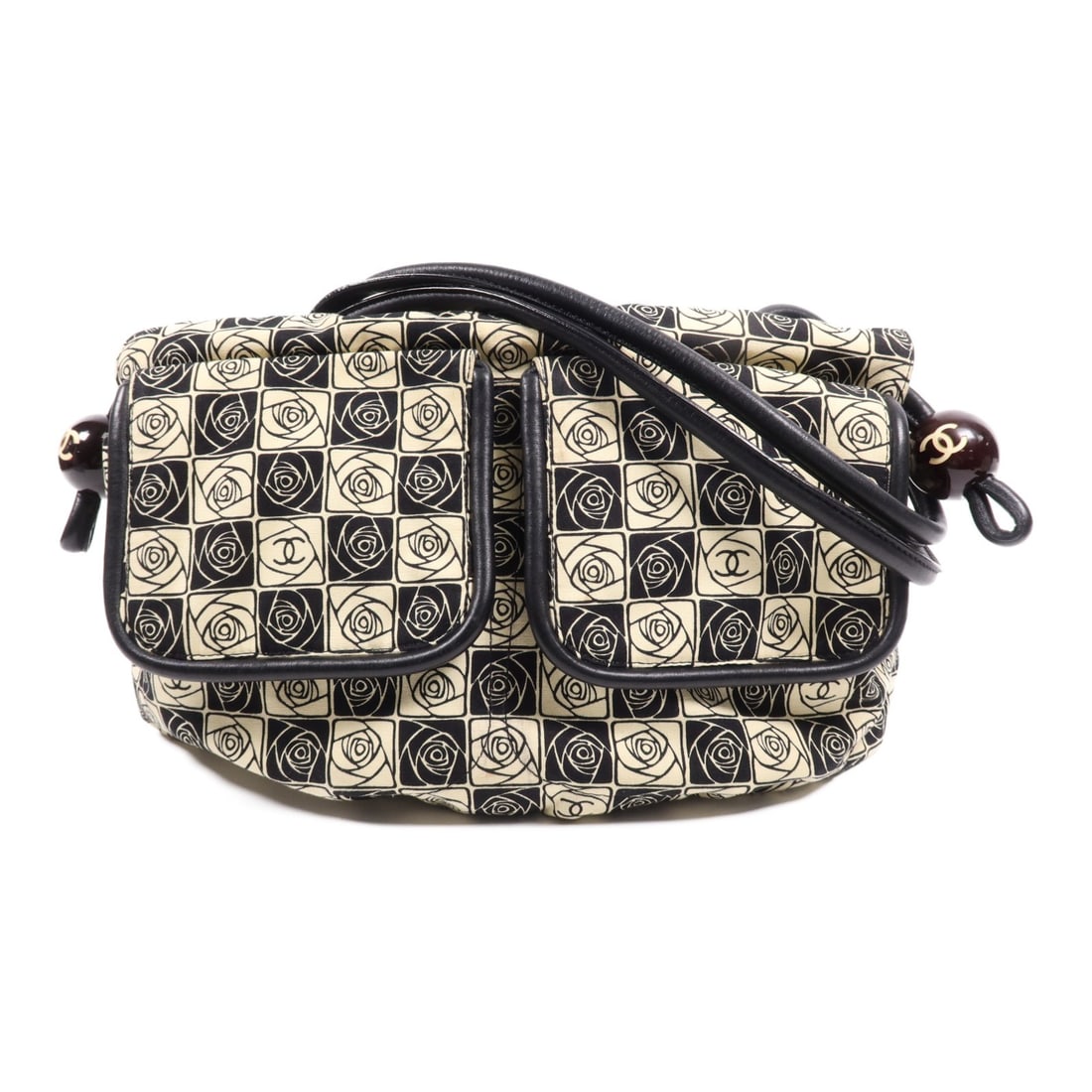 CHANEL Vintage Black Beige Canvas Shoulder Bag with SHW: CHANEL Vintage Black Beige Canvas Shoulder Bag with SHW Introducing a vintage CHANEL shoulder bag, a perfect blend of luxury and practicality. Crafted from durable black canvas, this stylish bag featu