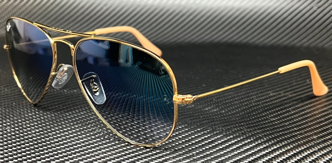 Ray-Ban RB3025 001 3F Gold Aviator Sunglasses with Gradient Blue Lenses: Ray-Ban RB3025 001 3F Gold Aviator Sunglasses with Gradient Blue Lenses Experience timeless style with the Ray-Ban RB3025 001 3F Gold Pilot Sunglasses. Featuring a striking gold metal frame and gradie