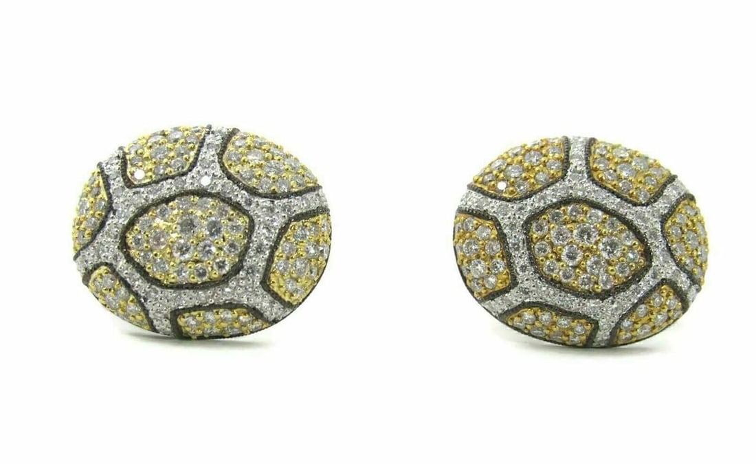 Vintage Oval Earrings in 14k Yellow and White Gold with Multicolor Diamonds: Vintage Oval Earrings in 14k Yellow and White Gold with Multicolor Diamonds This vintage pair of oval-shaped stud earrings is crafted from 14k yellow and white gold with black rhodium accenting. The e