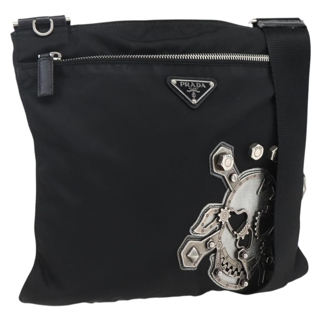 Prada Black Nylon Shoulder Bag with Silver Details and Dust Bag: Prada Black Nylon Shoulder Bag with Silver Details and Dust Bag This PRADA shoulder bag is crafted from black nylon with silver-tone accents. Designed for women, it features a sleek silhouette with ad