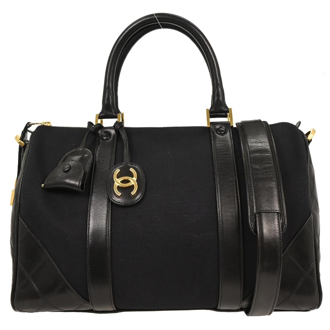 Chanel Black Canvas Lambskin 2way Duffle Handbag Gold Hardware: Chanel Black Canvas Lambskin 2way Duffle Handbag Gold Hardware Elevate your style with this luxurious Chanel Black Canvas Lambskin Bicolore 2way Duffle Handbag. Designed for casual occasions, this med