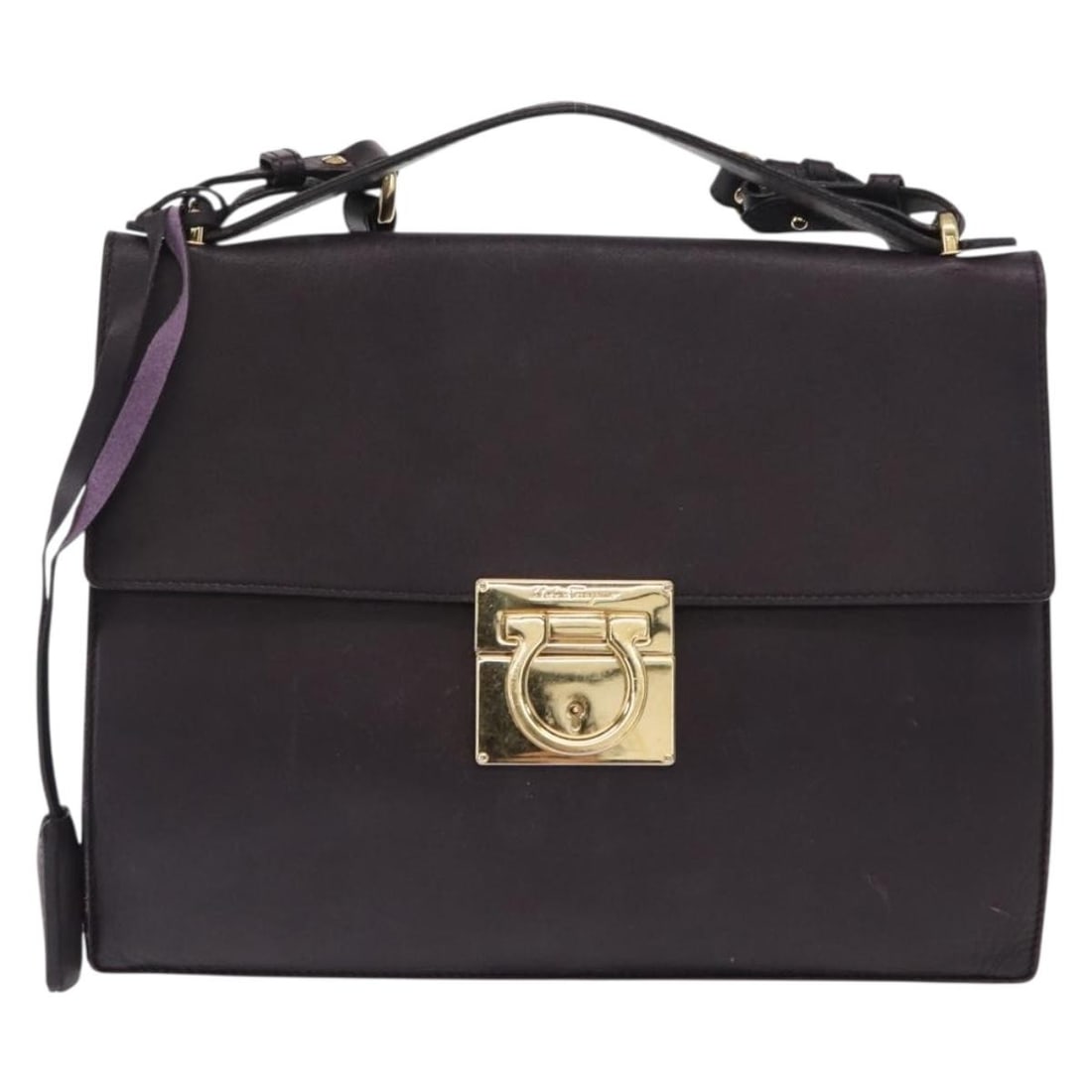 Salvatore Ferragamo Leather Purple Gancini Shoulder Handbag: Salvatore Ferragamo Leather Purple Gancini Shoulder Handbag This pre-owned Salvatore Ferragamo Gancini shoulder bag for women features purple leather construction with a classic design. The bag shows