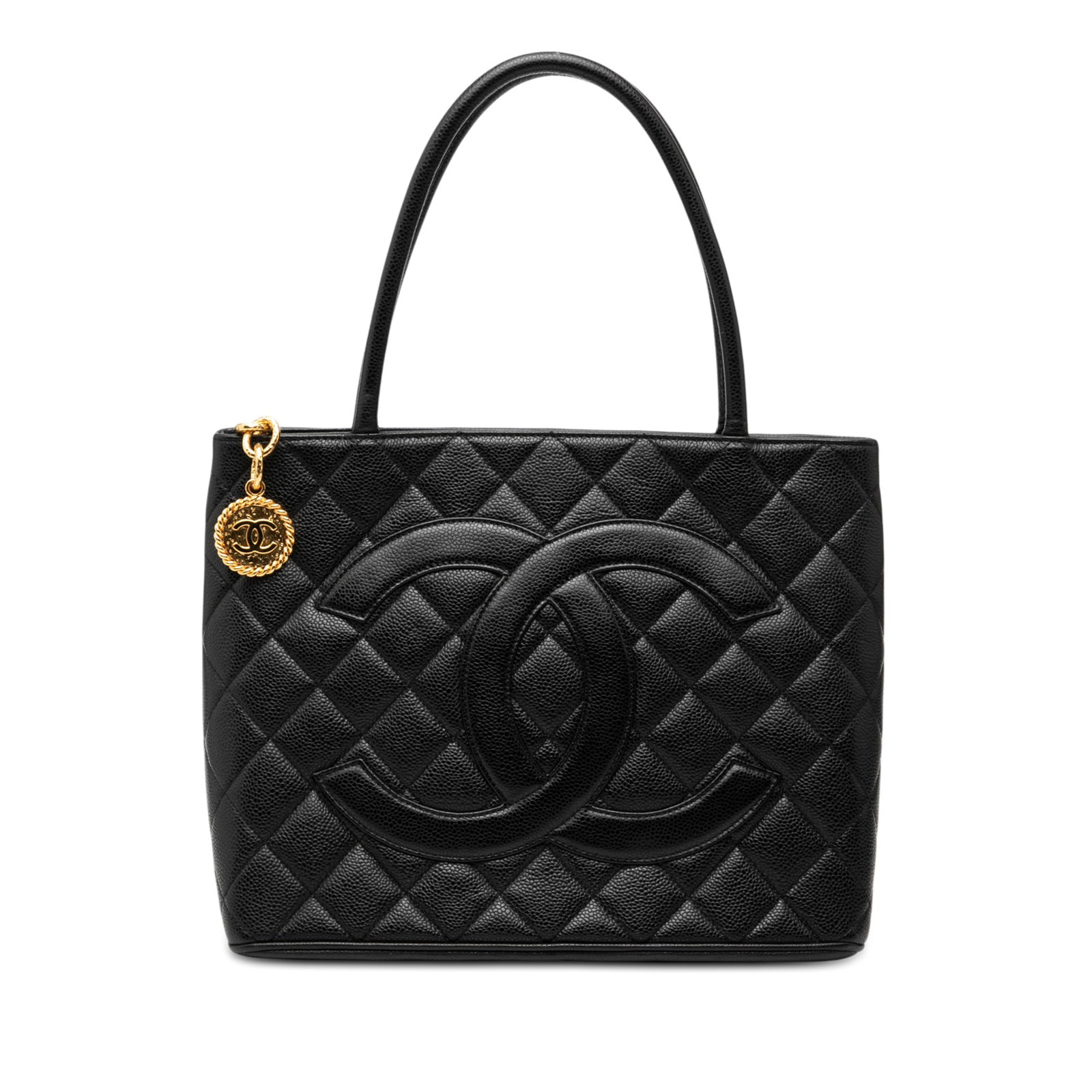 Black Caviar Leather Medallion Tote Bag by Chanel with Quilted Design: Black Caviar Leather Medallion Tote Bag by Chanel with Quilted Design This Chanel Medallion tote features a quilted caviar leather exterior in black, rolled leather handles, a top zip closure, an exte