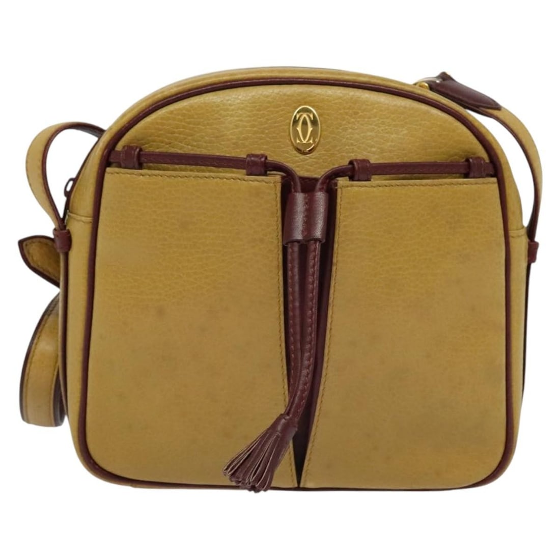 Must de Cartier beige leather crossbody bag with tassel detail: Must de Cartier beige leather crossbody bag with tassel detail This Must de Cartier crossbody bag features a tasseled design and is crafted from beige leather. Designed for women, it offers a compact