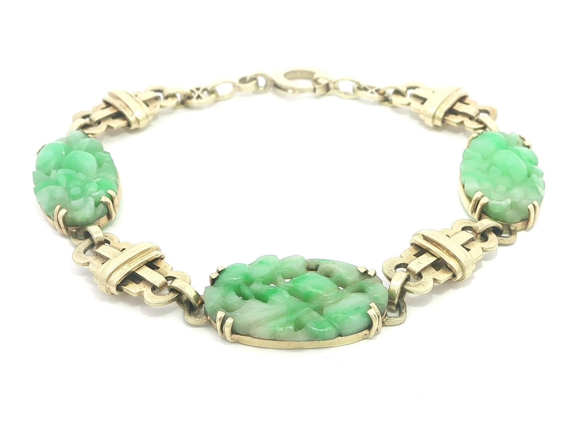 Art Deco 14k Yellow Gold Bracelet with Carved Jade Geometric Links: Art Deco 14k Yellow Gold Bracelet with Carved Jade Geometric Links This antique Art Deco bracelet features three natural carved oval jade stones set in open geometric links of solid 14k yellow gold. T