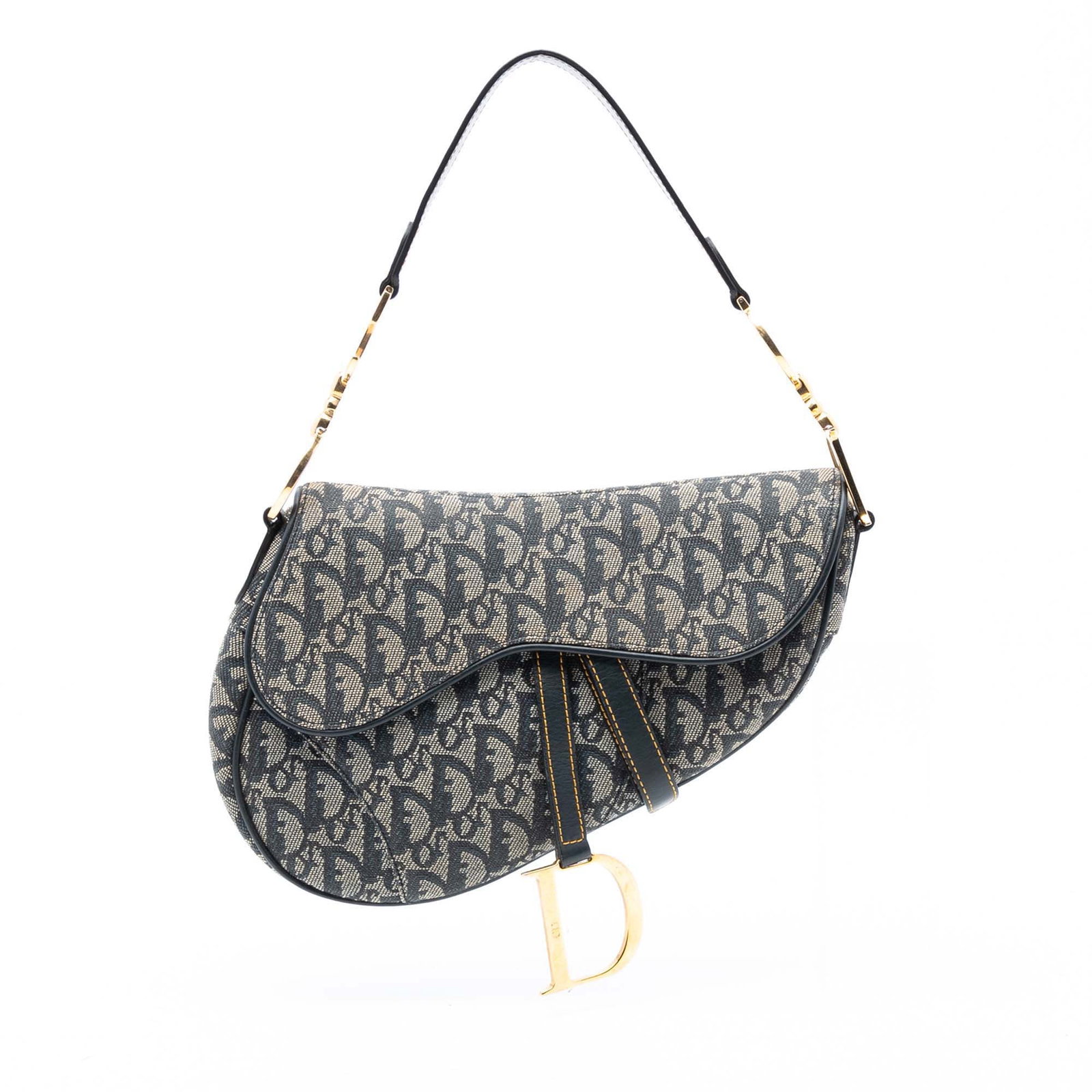 Dior Diorissimo Blue Canvas Saddle Bag with Leather Trim: Dior Diorissimo Blue Canvas Saddle Bag with Leather Trim This Diorissimo Canvas Saddle Bag features a canvas body with flat leather trim, a flat leather shoulder strap, a front flap with magnetic clos