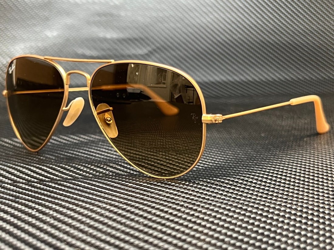 Ray-Ban RB3025 112 85 Gold Aviator Sunglasses Unisex 55mm: Ray-Ban RB3025 112 85 Gold Aviator Sunglasses Unisex 55mm Discover the timeless elegance of Ray Ban RB3025 Aviator Sunglasses, designed for both men and women. These sunglasses feature a striking gold