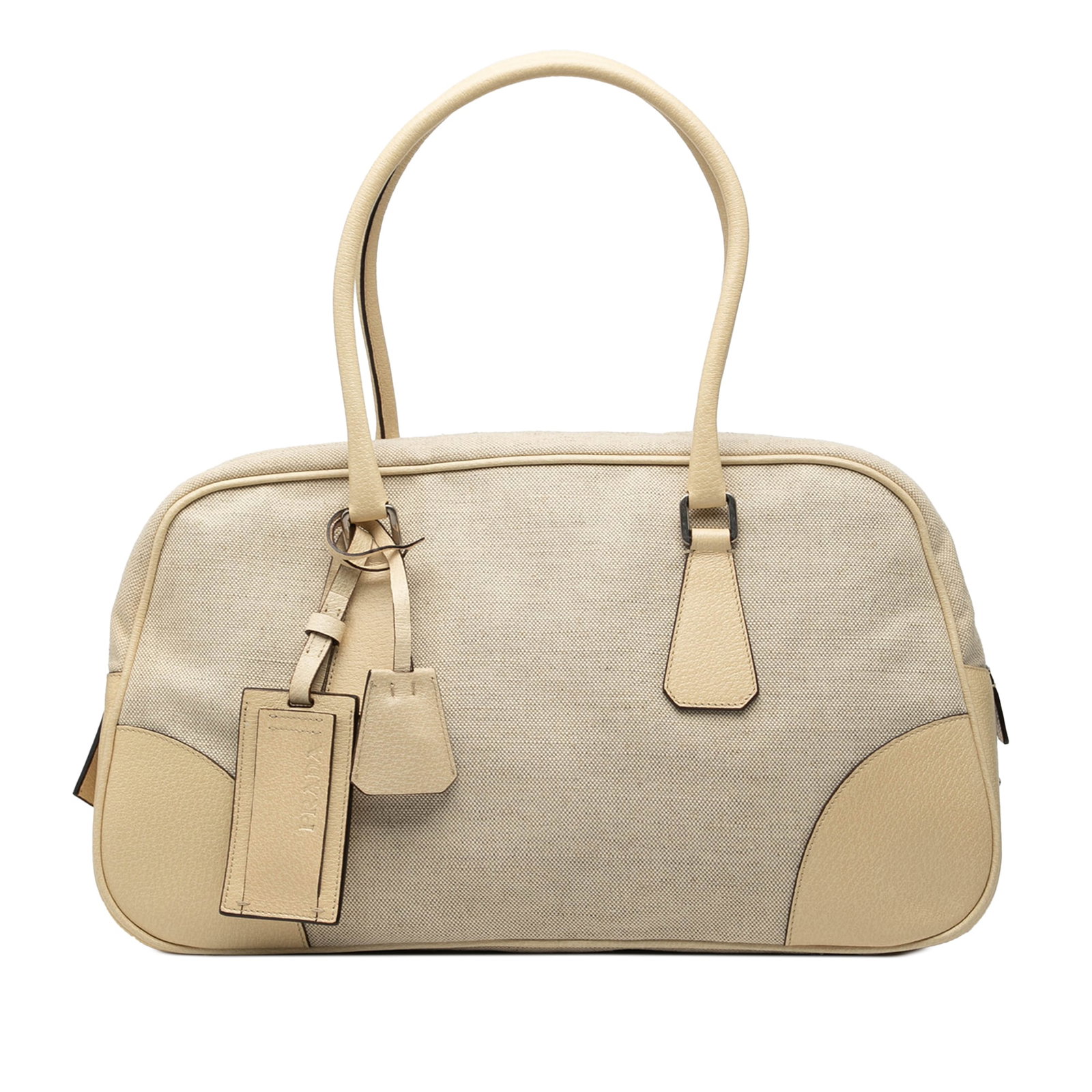 Beige Canvas Bag with Leather Trim by Prada: Beige Canvas Bag with Leather Trim by Prada This Prada shoulder bag features a beige canvas body with leather trim, rolled leather handles, a top zip closure, and an interior zip pocket. It comes with