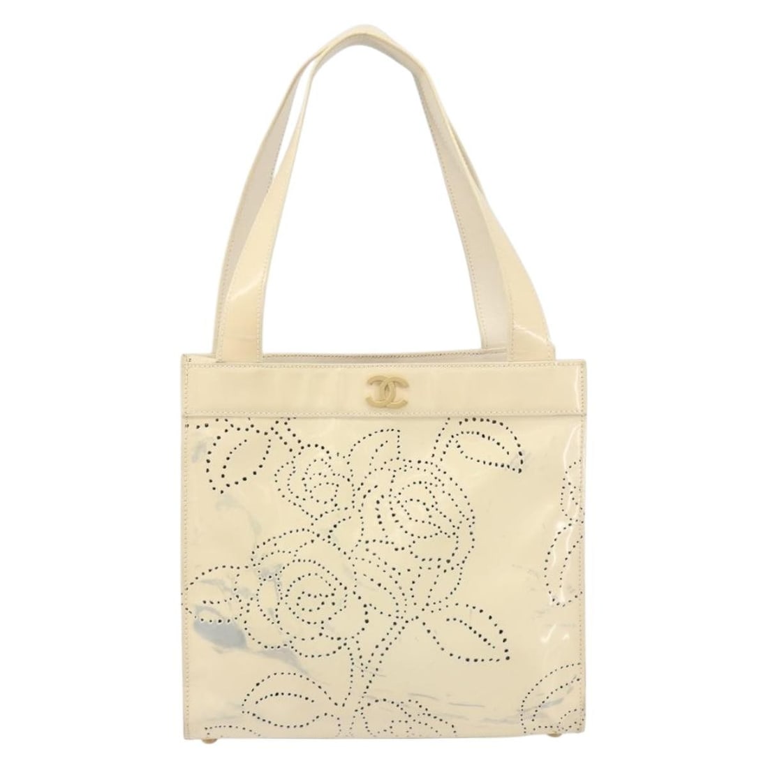Beige Patent Leather Tote Bag Chanel Camellia 24cm by 23cm by 10cm: Beige Patent Leather Tote Bag Chanel Camellia 24cm by 23cm by 10cm This Chanel Camellia Tote for women is crafted from beige patent leather with a structured silhouette. It features a shoulder strap a