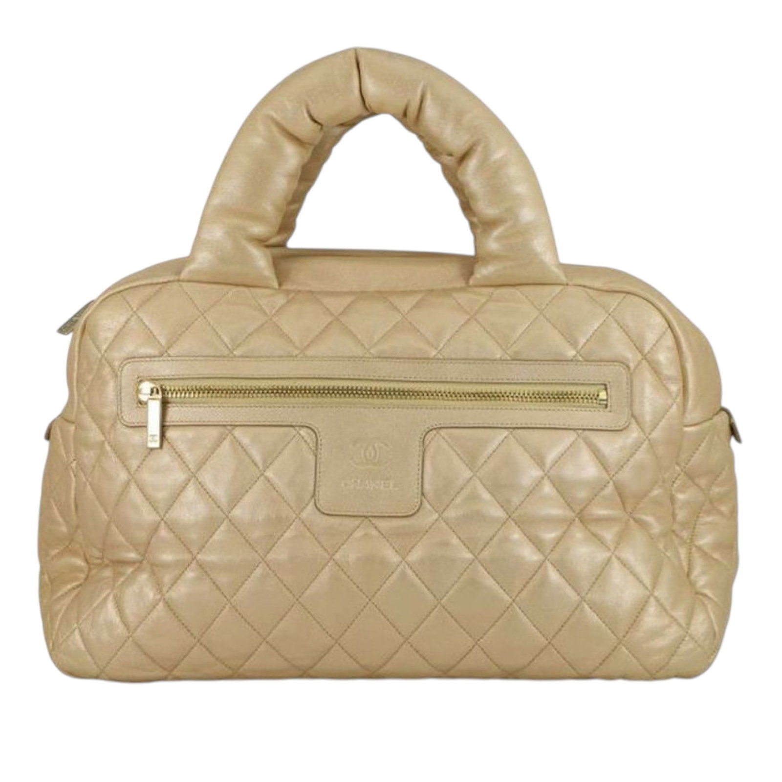 Chanel Coco Cocoon Gold Quilted Metallic Lambskin Bowler Handbag: Chanel Coco Cocoon Gold Quilted Metallic Lambskin Bowler Handbag This Chanel Cocoon Bowler bag is crafted from quilted metallic lambskin leather in gold. It features rolled handles, a top zip closure,
