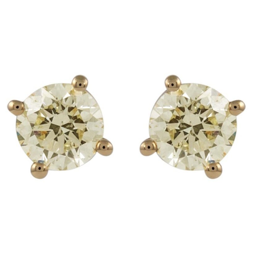1.06ct Round Diamond Stud Earrings in 18k Yellow Gold with GIA Appraisal: 1.06ct Round Diamond Stud Earrings in 18k Yellow Gold with GIA Appraisal These exquisite diamond stud earrings feature two matching round brilliant diamonds with a total weight of 1.06 ct. Set in luxu