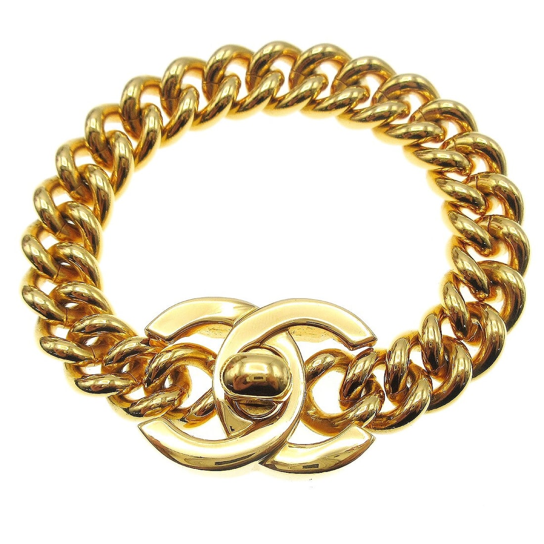 Chanel Gold-Plated Turnlock Chain Bracelet 7.5 Inch: Chanel Gold-Plated Turnlock Chain Bracelet 7.5 Inch This exquisite Chanel Turnlock Chain Bracelet features a stunning gold-plated design, ideal for adding a touch of elegance to any outfit. The bracel