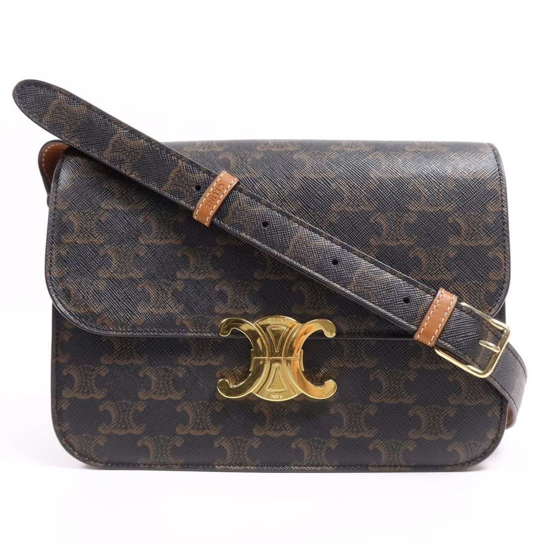 CELINE Triomphe 22 Shoulder Bag Brown Coated Canvas GHW: CELINE Triomphe 22 Shoulder Bag Brown Coated Canvas GHW Introducing the CELINE GHW Triomphe 22 Shoulder Bag, crafted from durable PVC coated canvas in a rich brown color. This stylish shoulder bag is