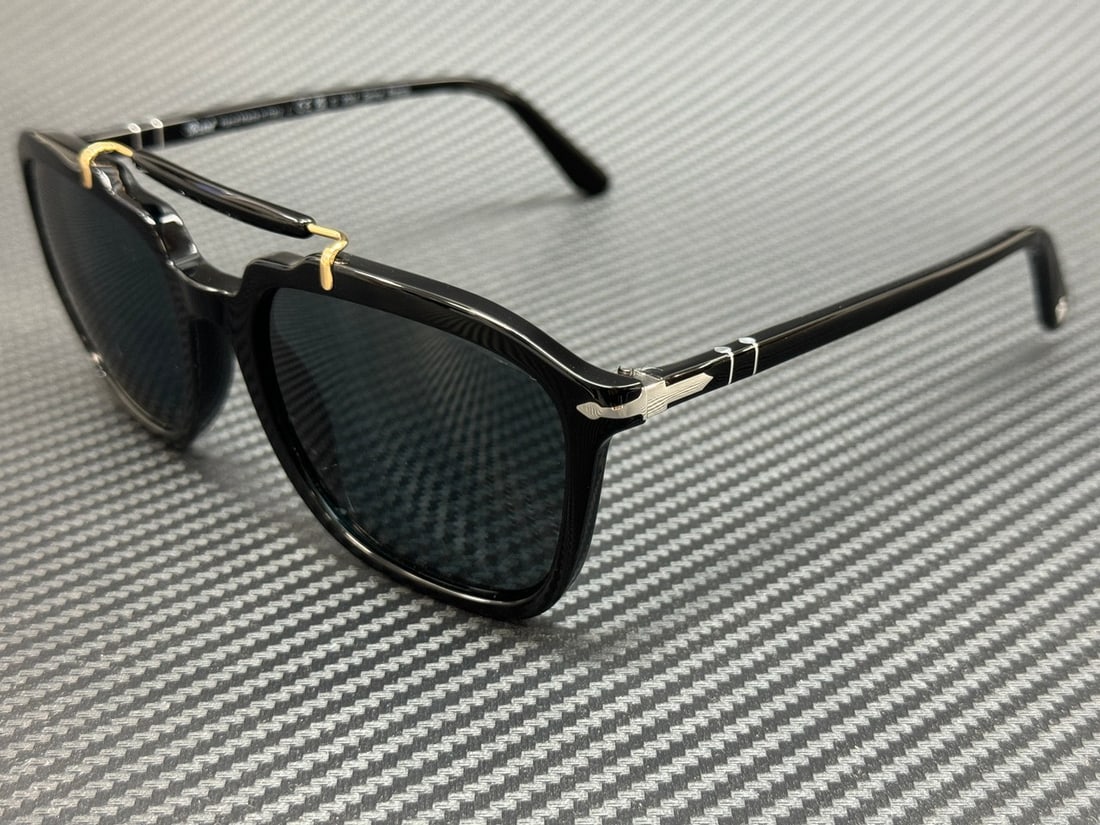 Persol PO0203S 95 3R Black Frame Dark Blue Polarized Sunglasses: Persol PO0203S 95 3R Black Frame Dark Blue Polarized Sunglasses Elevate your style with these Persol PO0203S 95 3R sunglasses, designed for both men and women. Featuring a sleek black frame complement