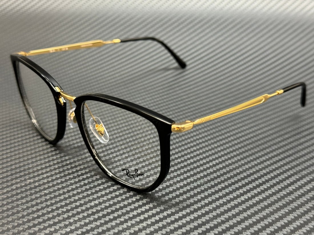 Ray-Ban RX4451V 2000 Black Gold Unisex Eyeglasses 53mm: Ray-Ban RX4451V 2000 Black Gold Unisex Eyeglasses 53mm Discover the perfect blend of style and functionality with these Ray-Ban RX4451V 2000 eyeglasses. Featuring a sleek black and gold frame, these u