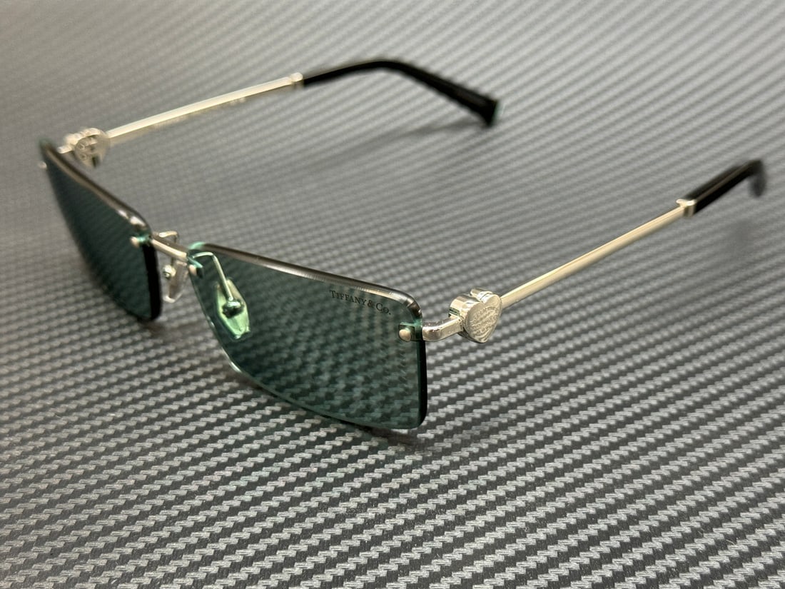 Tiffany & Co. TF3108B 62227C Silver Mirror 60mm Women's Sunglasses: Tiffany & Co. TF3108B 62227C Silver Mirror 60mm Women's Sunglasses Elevate your style with these elegant Tiffany & Co. TF3108B 62227C sunglasses. Featuring a stunning silver mirror lens, these women's