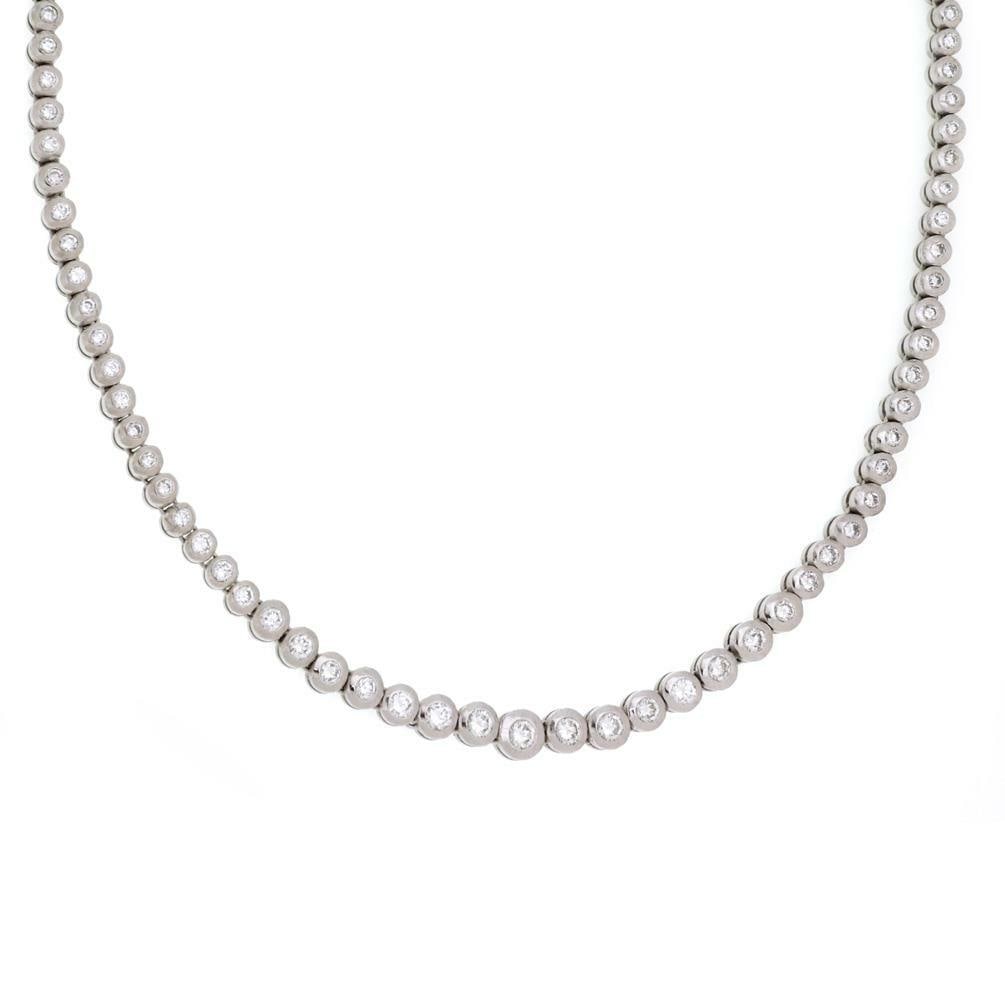 Platinum Tennis Necklace 4.00 ct Diamond Graduated Bezel Set: Platinum Tennis Necklace 4.00 ct Diamond Graduated Bezel Set This exquisite tennis necklace features a stunning array of diamonds set in a luxurious platinum setting. The necklace showcases approximat